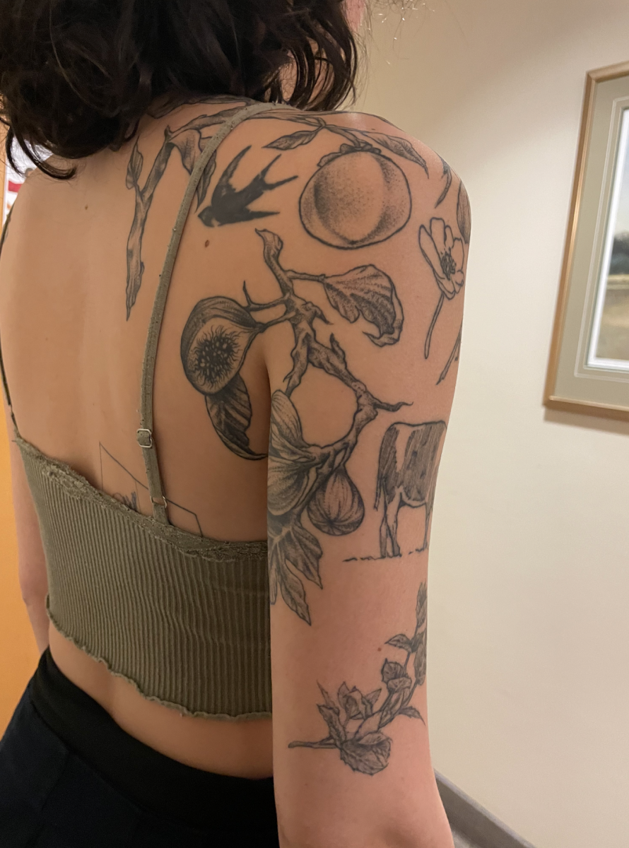 Golondrinas shoulder tattoos featuring flora and fauna.